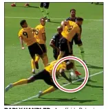  ??  ?? BADLY HANDLED : An offside Boly gives Wolves their controvers­ial goal