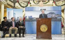  ?? ALYSSA POINTER / ALYSSA. POINTER@AJC. COM ?? Gov. Nathan Deal speaks as Jim Squires, Atlanta Mayor Keisha Lance Bottoms and Brian Kemp listen.