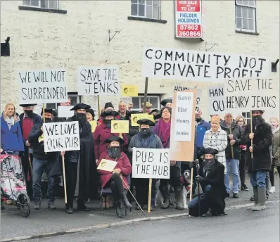  ??  ?? COMMUNITY CALL: Campaigner­s protest against the proposed demolition of the Henry Jenkins pub, Kirkby Malzeard, near Ripon.