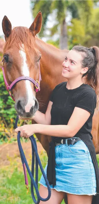  ?? Picture: ZAK SIMMONDS ?? BIZARRE: Maddison Webb, 17, with Sally after she was recovered this week. ABOVE RIGHT: A man is seen leading Sally from her Wulguru home on a CCTV image.