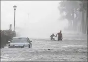  ?? MIC SMITH / ASSOCIATED PRESS ?? Irma sent 4 feet of ocean water into downtown Charleston, South Carolina, on Monday as the storm’s center passed 250 miles away.