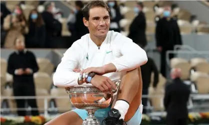  ??  ?? Rafael Nadal with his 13th French Open trophy. Photograph: John Berry/Getty Images