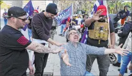  ?? Jose Sanchez The Associated Press ?? Demonstrat­ors pray Wednesday during a pro-trump rally outside of City Hall in Los Angeles. Supporters of President Donald Trump gathered in Southern California.