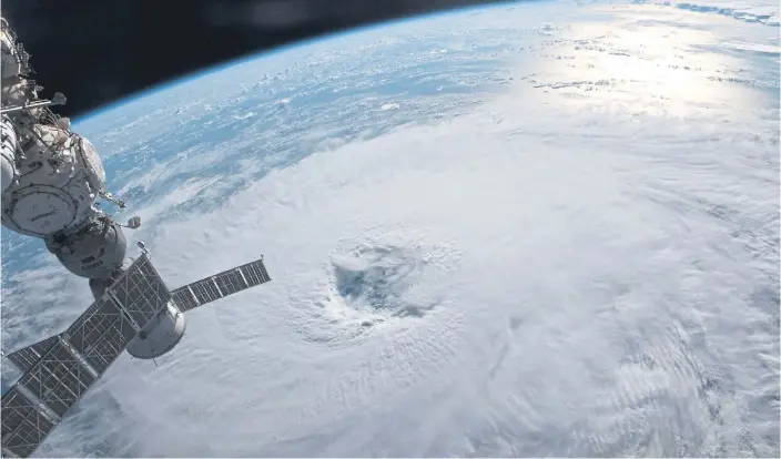  ?? ?? STORMY: Category 1 Hurricane Nigel on September 19, 2023 on a northeaste­rly track in the Atlantic Ocean as the Internatio­nal Space Station orbited 259 miles above; above left, is the Soyuz MS-23 crew ship.