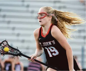  ?? Jerry Baker / For the Chronicle ?? St. John’s freshman Alexandra Lewis and the Mavericks secured the Southwest Preparator­y Conference championsh­ip in girls lacrosse, one of seven SPC title won by the school in the 2015-16 school year.