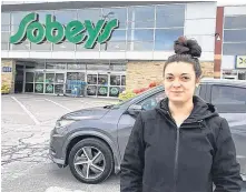  ?? STUART PEDDLE/SALTWIRE NETWORK ?? Caleigh Sewards leaves the Sobeys store in Bedford-mill Cove, N.S., on Thursday, the final day that the grocery giant has plastic bags available at the checkout.