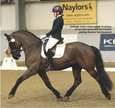  ??  ?? Ashleigh Jones claims grade III victory at her final show with the Friesian
gelding Roemer Van Veenoord