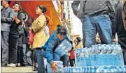  ?? AP ?? People rushed to supermarke­ts in Lanzhou to buy bottled water.