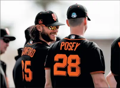  ?? RANDY VAZQUEZ — BAY AREA NEWS GROUP, FILE ?? The Giants’ Brandon Crawford, left, smiles while talking to teammate Buster Posey during spring training in Scottsdale, Ariz., on Feb. 21.