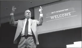  ?? NWA Democrat-Gazette/FLIP PUTTHOFF ?? Marlin Berry, superinten­dent of Rogers Public Schools, welcomes teachers during the Thank A Teacher Celebratio­n on Aug. 9 in the Rogers High School auditorium. Berry welcomed district teachers for the school year that starts Wednesday at most Rogers...