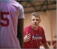  ?? MEDIANEWS GROUP FILE PHOTO ?? Archbishop Carroll boys basketball coach Paul Romanczuk directs traffic in a defensive drill in this 2014 photo.