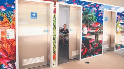  ?? ?? Nathan Hargreaves tests out the colourful public toilets near the Lake St multistore­y carpark. Picture: Justin Brierty