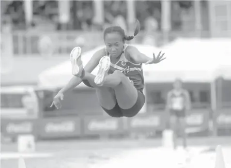  ?? KRISTINE JOYCE CAMPANA ?? Jhuvan Baculot of Team Cebu City competes in secondary girls high jump event of athletics competitio­n in the 2018 CVIRAA Meet yesterday at the CPG Sports Complex in Tagbilaran City.