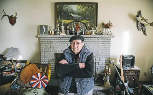  ?? Andrew Rush/Post-Gazette ?? Don Lutz poses at his home in Ellport on Friday. The 84-year-old former weightlift­er, gymnast and Korean War veteran sleeps with a loaded pistol beneath his pillow and used it to kill one of two men who broke in early Friday. The second intruder fled.