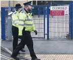  ??  ?? PRESENCE Officers at school yesterday