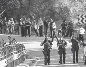  ?? QUIQUE GARCIA, EUROPEAN PRESSPHOTO AGENCY ?? Police officers shot a man wearing what looked like an explosive belt Monday in Subirats, near Barcelona, where a van crashed into pedestrian­s on Las Ramblas promenade last week.