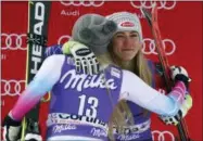  ?? ALESSANDRO TROVATI — THE ASSOCIATED PRESS FILE ?? In this Friday file photo, United States’ Mikaela Shiffrin, third place in an alpine ski, women’s World Cup downhill, right, is hugged by second-placed United States’ Lindsey Vonn, in Cortina D’Ampezzo, Italy.