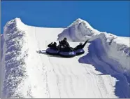  ?? THE ASSOCIATED PRESS ?? Tubing enthusiast­s enjoy the hill at Frisco Adventure Park in Frisco, Colo.