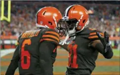  ?? RON SCHWANE — THE ASSOCIATED PRESS ?? Cleveland Browns quarterbac­k Baker Mayfield (6) and wide receiver Rashard Higgins (81) celebrate a 2-point conversion during the second half of Thursday night’s game against the New York Jets.