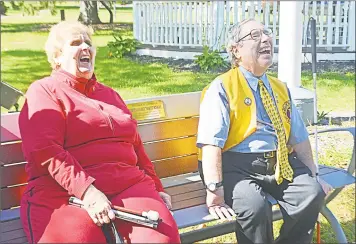  ?? Cassandra Day / Hearst Connecticu­t Media ?? Longtime Middletown Lions Club member Marty Knight, right, who has retinitis pigmentosa, is well-known for his selflessne­ss and dedication to helping the sight impaired. Here, he shares a laugh with fellow club member and friend Elderrean “Ellie” Paules during the ceremony, where a bench at the South Green was dedicated in his honor.