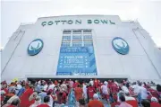  ??  ?? Fans file into Cotton Bowl Stadium in Dallas before Texas’ 48-45 win against Oklahoma on Oct. 6.