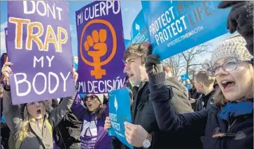  ?? Drew Angerer Getty Images ?? ADVOCATES FOR both sides of the abortion issue rally outside the Supreme Court building in March.