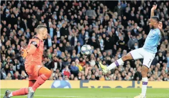  ?? | Reuters ?? MANCHESTER City’s Raheem Sterling scores his side’s fifth goal against Atalanta to complete his hat-trick on Tuesday.