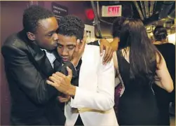  ?? Al Seib Los Angeles Times ?? ASHTON SANDERS, left, and Jharrel Jerome of the “Moonlight” cast embrace after the film was awarded the Academy Award for best picture.