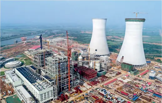  ?? (CNSPHOTO) ?? A coal power plant with low carbon emission is being built in Hefei, Anhui Province, on June 23, 2018