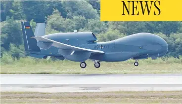  ?? ARMIN WEIGEL/AFP/GETTY IMAGES ?? The unmanned Euro Hawk plane lands at the airbase in Manching, Germany, after a non-stop flight from California. Transport Canada is reportedly considerin­g buying the drones for Arctic surveillan­ce.