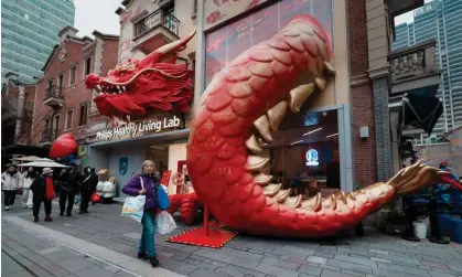  ?? Photograph: Alex Plavevski/EPA ?? Analysts are now looking at whether the year of the dragon will breathe some much-needed fire into the belly of the Chinese economy.