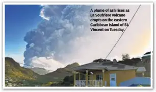  ??  ?? A plume of ash rises as La Soufriere volcano erupts on the eastern Caribbean island of St. Vincent on Tuesday.