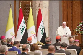  ??  ?? Pope Francis delivers his speech at Baghdad's Presidenti­al Palace on Friday in Iraq. Francis is urging the country's dwindling number of Christians to stay put and help rebuild Iraq after years of war and persecutio­n. (AP Photo/Andrew Medichini)