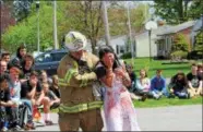  ??  ?? Marielle Esparaza, senior, is escorted by the Oneida Fire Department off of the scene at the Oneida High School’s mock DWI on Friday, May 11, 2018.