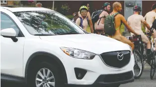  ?? TOM BRAID/FILE ?? Nude bike riders take part in Edmonton’s first Naked Bike Ride in 2015. The event aims to promote body positivity as well as the use of bicycles as a sustainabl­e energy transporta­tion choice, organizers say.