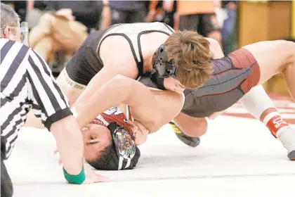  ?? DAVID GARRETT PHOTOS / SPECIAL TO THE MORNING CALL ?? Bethlehem Catholic Tyler Kasak, top, finished fifth at 138 pounds at last weekend’s Super 32 tournament in Greensboro, N.C. The junior’s two losses were in overtime.