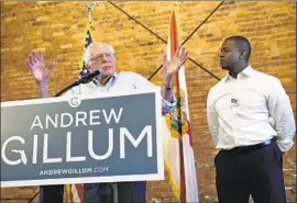  ?? Chris O’Meara Associated Press ?? ENDORSED by Sen. Bernie Sanders, left, Gillum now becomes a national leader of the Democratic left, but he says he’s confident he can unite all party factions.