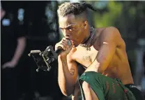  ?? MATIAS J. OCNER/THE MIAMI HERALD, TNS, VIA GETTY IMAGES ?? XXXTentaci­on, who had millions of followers, was facing charges of abusing an ex-girlfriend when he was shot to death during an attempted robbery.