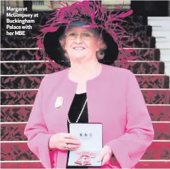  ??  ?? Margaret McGimpsey at Buckingham Palace with her MBE