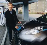  ??  ?? John Alexander, Council Leader with his EV