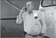  ?? JOHN SLADEWSKI/STANDARD TIMES VIA AP, FILE ?? In this Oct. 14, 2014, file photo, Carlos Rafael talks on the phone at Homer’s Wharf near his herring boat F/V Voyager in New Bedford, Mass.