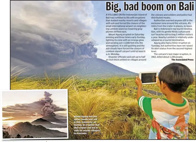  ??  ?? Mount Agung volcano spews smoke and ash in Bali, Indonesia, on Sunday, in eruption that shut airport and led to calls for nearby villagers to evacuate.