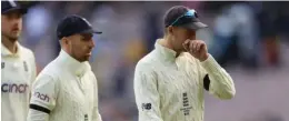  ?? ?? England Captain Joe Root (right) walks off the pitch after Ashes defeat