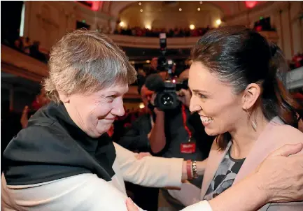  ?? PHOTO: DAVID WHITE/STUFF ?? Former PM Helen Clarke embraces Ardern during the Labour Party campaign launch last August – one of many hugs on the trail. Does all the hand-holding and hugging become a chore? “I like it!” she exclaims.