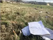  ?? TRAVIS LOLLER — THE ASSOCIATED PRESS ?? Pages from a recipe book lie in a yard Wednesday after a tornado destroyed much of a subdivisio­n near McBroom Chapel Road in Putnam County, Tennessee, before dawn on March 3.