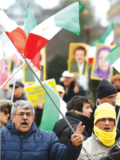  ?? (Francois Lenoir/Reuters) ?? Ashkelon Washington A WOMAN chants slogans during a protest against the visit of Iran’s Foreign Minister Mohammad Javad Zarif, outside the European Union Council in Brussels, earlier this week.