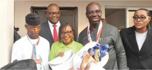  ??  ?? L-R (front row): Vice President Yemi Osinbajo; Edo State best teacher and beneficiar­y of a two-bedroom apartment gift in Emotan Gardens, Mrs. Osaru Noragbon; Edo State Governor, Mr. Godwin Obaseki; Executive Chairman, Edo Developmen­t and Property Agency, Isoken Omo; and Managing Director, Mixta Nigeria, Kola Ashiru-Balogun (back row), at the commission­ing