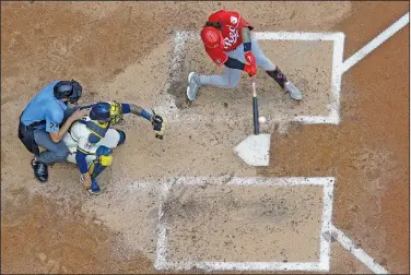  ?? Associated Press ?? Going yard: Cincinnati Reds' Jonathan India hits a three-run home run during the fifth inning of a baseball game against the Milwaukee Brewers Thursday in Milwaukee.