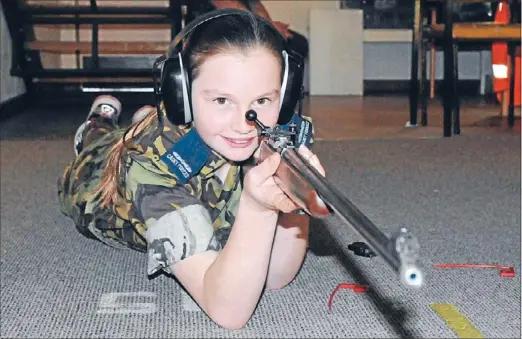  ?? Photo: ANDREA O’NEIL ?? Gun un-shy: Grace O’Neill, 13, overcame her shyness after joining the Porirua air cadets and has thrown herself into activities such as rifle training.