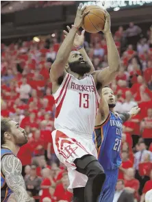  ?? AP PHOTO ?? SOARING: James Harden goes to the hoop past the Thunder’s Andre Roberson for two of his 34 points in the Rockets’ clinching victory last night in Houston.